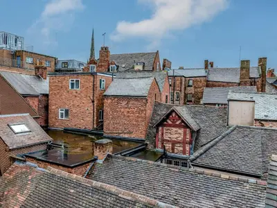 an aerial view of roofs of buildings at 5C Charming Town Centre Apartment With Roof Top Views - Pass the Keys in Shrewsbury