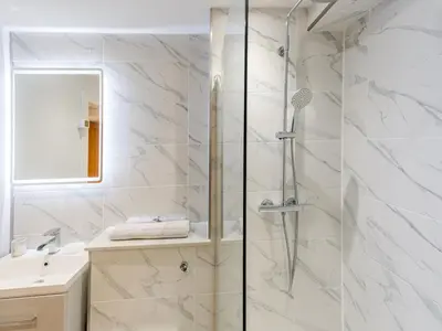 a bathroom with a shower and a sink at Amaranth Stylish town centre apartment - Pass the Keys in Shrewsbury
