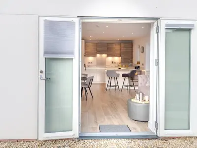 an open door to a kitchen and a living room at 1 bed Albury Contemporary Apartment with Secure Parking - Pass the Keys in Shrewsbury