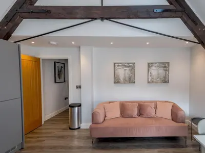 a couch in the middle of a living room at 1 bed 40D Dahlia Contemporary town centre apartment - Pass the Keys in Shrewsbury