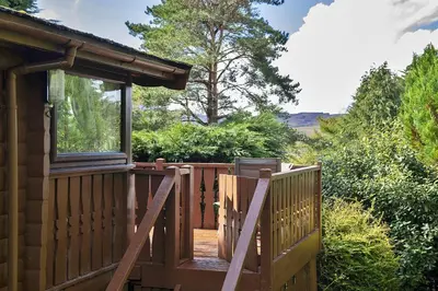 a wooden gate to a cabin with a window at Finest Retreats - Mountain View in Trawsfynydd