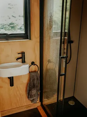 a bathroom with a sink and a shower at Hoku in Llangollen