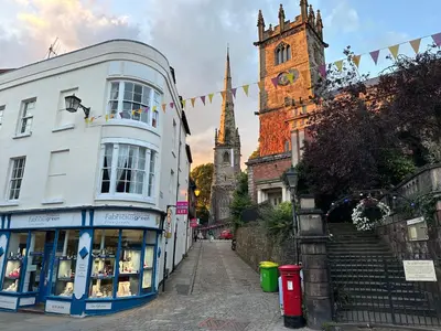 a city street with buildings and a church at Shrewsbury Townhouse - Free Parking in Shrewsbury