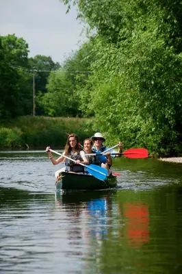 a group of people in a boat on a river at Bullrush Barn, Brecon Beacons walkers retreat in Brecon