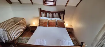 a bedroom with a bed with pillows on it at Gaer Hall Guilsfield a country mansion with hottub in Welshpool