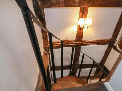 an overhead view of a stairs with a light on it at 18 Church Street in Llangollen