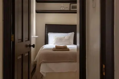 a bedroom with a bed with a stuffed animal on it at Lake House in Brecon