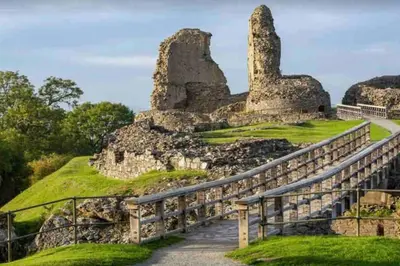 a staircase leading up to the ruins of a castle at Ty Twty, Montgomery Cottage in Montgomery