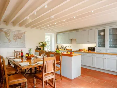 a kitchen with a table and chairs in a room at 4 Bed in Corwen oc-88868 in Corwen