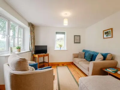 a living room with a couch and a tv at 4 Bed in Corwen oc-88868 in Corwen