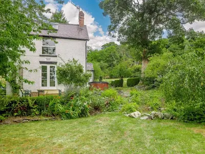 an old house with a garden in front of it at 4 Bed in Corwen oc-88868 in Corwen