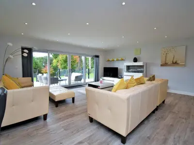 a living room with two white couches and a television at 4 Bed in Oswestry oc-75175 in Kinnerley