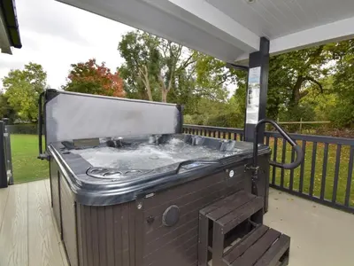 a barbecue grill sitting on a screened porch at 4 Bed in Oswestry oc-75175 in Kinnerley