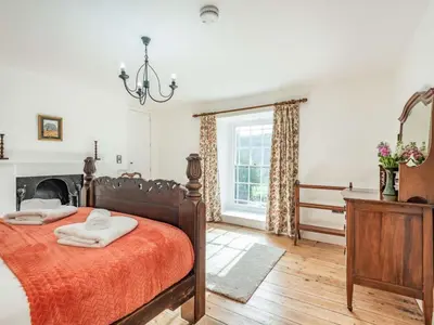 a bedroom with a bed with two towels on it at 3 Bed in Corwen oc-86266 in Corwen