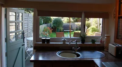 a kitchen with a sink and a window at Bronhaul Cottage in Pennal in Pennal