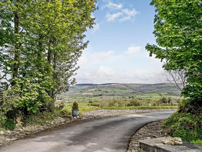 a road with a person standing on the side at 2 Bed in Llanybydder oc-81353 in Llanwenog