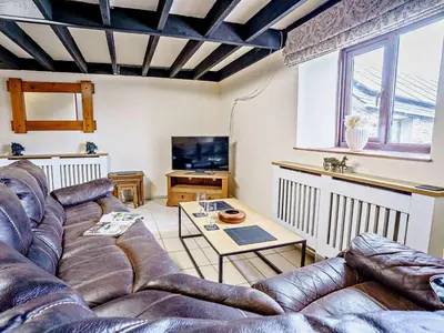 a living room with a couch and a table at 2 Bed in Llanybydder oc-81353 in Llanwenog