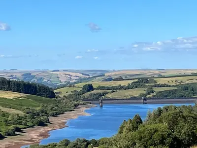 a view of a river with a bridge in the distance at 2 Bed in Brecon oc-bn100 in Cray