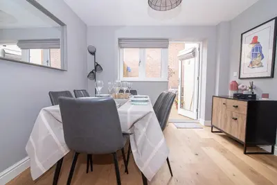 a dining room with a table and chairs at Elegant Ludlow Haven: 4Bed Ultimate Tranquility in Ludlow
