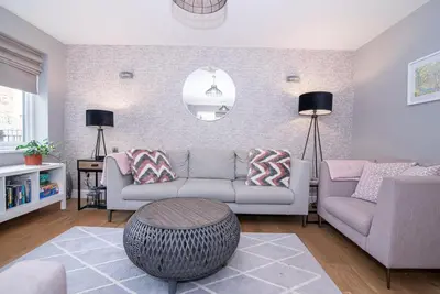 a living room with a couch and a table at Elegant Ludlow Haven: 4Bed Ultimate Tranquility in Ludlow
