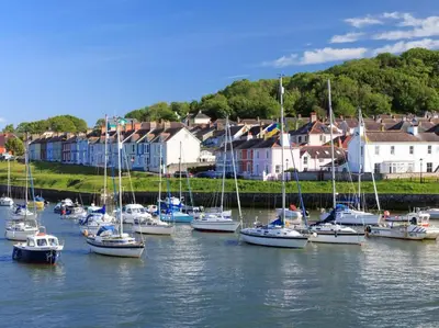 a bunch of boats are docked in a harbor at 1 Bed in Lampeter oc-43288 in Tregaron