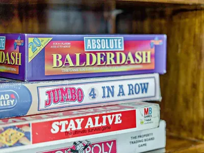 a pile of books on a shelf in a store at 2 Bed in Shrewsbury oc-47795 in Ryton