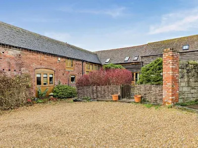 an old brick building with a yard in front of it at 2 Bed in Shrewsbury oc-47795 in Ryton