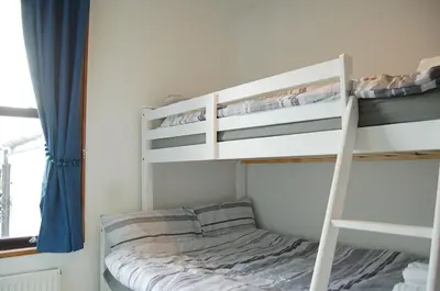 a bedroom with two bunk beds in a room at Idris View Family Holiday Home in Tywyn