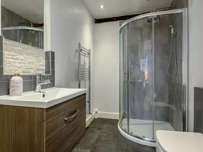 a bathroom with a shower and a sink at 3 Bed in Brecon oc-88249 in Brecon
