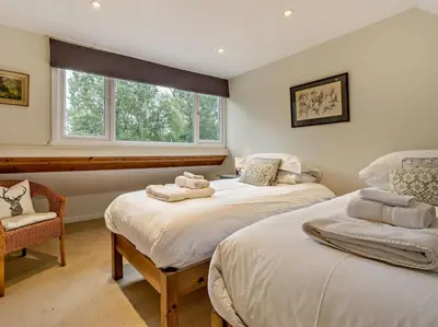 a bedroom with two beds and a window at 6 Bed in Brecon oc-bn171 in Llanspyddid
