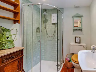 a bathroom with a shower and a toilet and a sink at 1 Bed in Brecon oc-bn157 in Llangorse