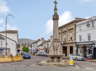 a statue in the middle of a city street at 1 Bed in Brecon oc-bn157 in Llangorse