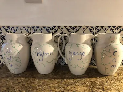 a group of three vases sitting on a counter at ryton grange hay barn sleeps 6 in Shrewsbury