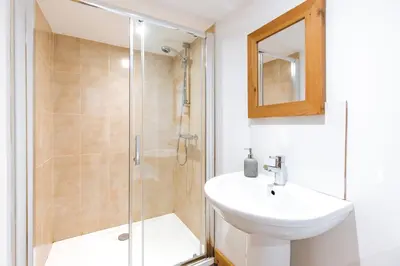 a bathroom with a sink and a shower at ryton grange hay barn sleeps 6 in Shrewsbury