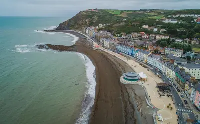 an aerial view of a beach and the ocean at Penglais Lodge in Aberystwyth