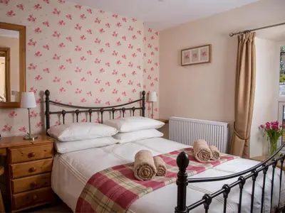 a bedroom with a bed with towels on it at 4 Bed in Brecon oc-bn151 in Devynock