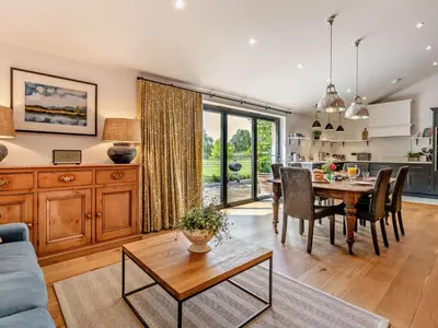 a kitchen and living room with a table and chairs at 2 Bed in Hereford oc-82095 in Byford