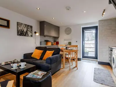 a living room with a couch and a table at 1 Bed in Brecon oc-bn034 in Cray