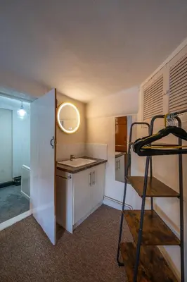 a kitchen with a sink and a ladder in a room at Town Centre Cottage 3 Bedroom inc Parking (1 car) in Shrewsbury