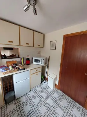 a small kitchen with a microwave and a counter at The Barn at the Mill in Selattyn