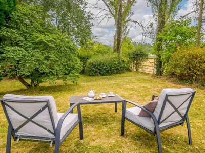 two chairs and a table in a yard at 1 Bed in Clyro BN260 in Clyro