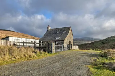 an old house on the side of a dirt road at Finest Retreats - Llechwedd Mawr in Talybont
