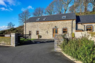 a stone house with a gate and a fence at Finest Retreats - Helygen in Talybont