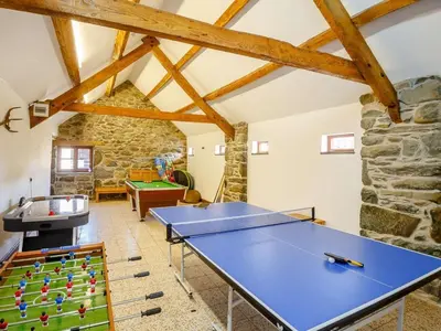 a ping pong table in a living room with a ping pong tableablish at 2 Bed in Dyffryn Ardudwy oc-89394 in Dyffryn