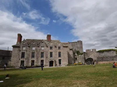 an old castle with people standing in front of it at 3 Bed in Hay-on-Wye 83593 in Hay-on-Wye