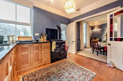 a kitchen with a sink and a stove top oven at 3 Bed in Aberaeron oc-b27954 in Aberaeron