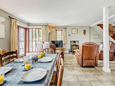 a living room with a table and chairs at 3 Bed in Aberdovey DY032 in Aberdyfi