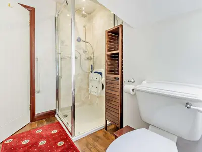 a bathroom with a shower and a toilet at 3 Bed in Aberdovey DY032 in Aberdyfi