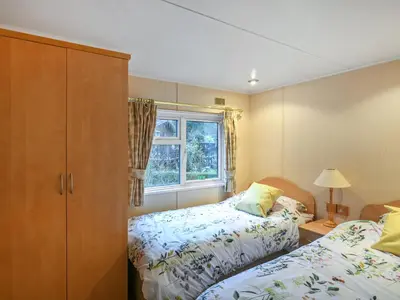 a bedroom with two beds and a window at The Beehive C29 - Uk45926 in Newtown