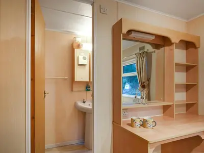 a small bathroom with a sink and a mirror at The Beehive C29 - Uk45926 in Newtown